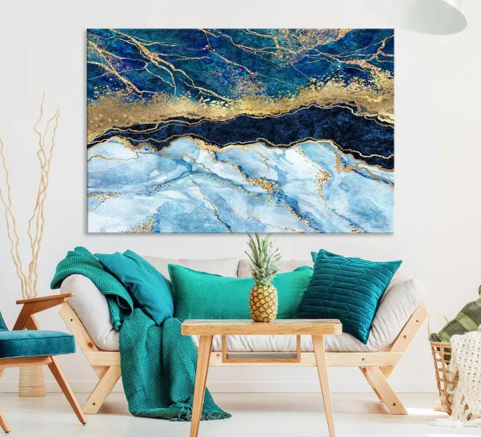 The room features a captivating Abstract Blue and Gold Marble Canvas Print displayed as a large 3-panel wall decor, infusing the space with modern elegance.