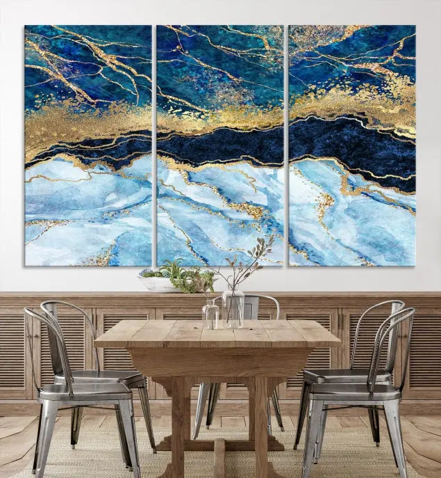 The room features a captivating Abstract Blue and Gold Marble Canvas Print displayed as a large 3-panel wall decor, infusing the space with modern elegance.