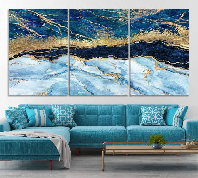 The room features a captivating Abstract Blue and Gold Marble Canvas Print displayed as a large 3-panel wall decor, infusing the space with modern elegance.