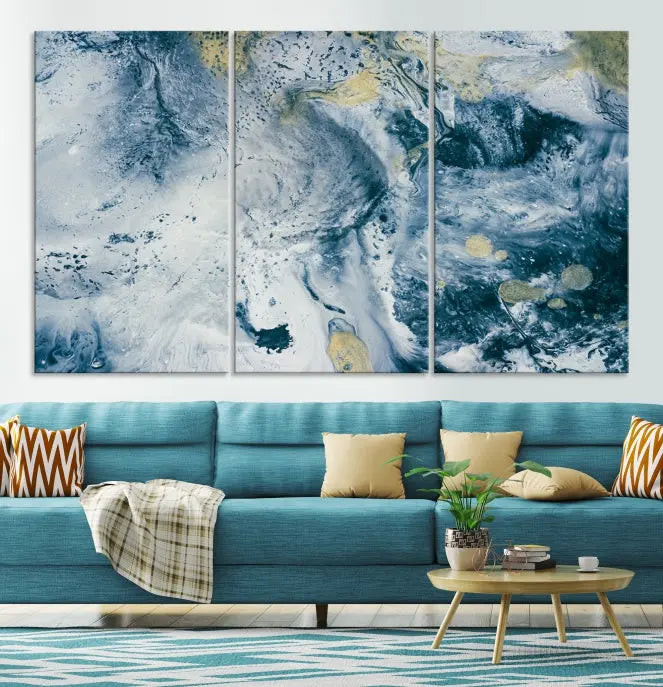 A modern living room features an Abstract Canvas Print as triptych artwork on the wall, elegantly showcased for enduring vibrancy.