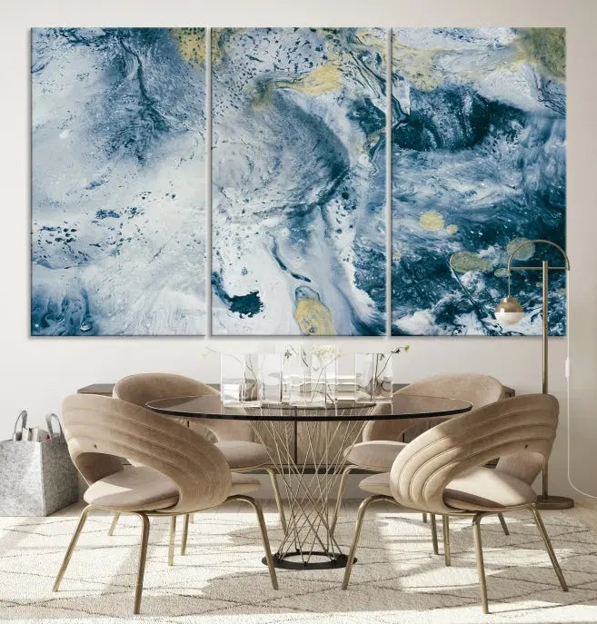 A modern living room features an Abstract Canvas Print as triptych artwork on the wall, elegantly showcased for enduring vibrancy.