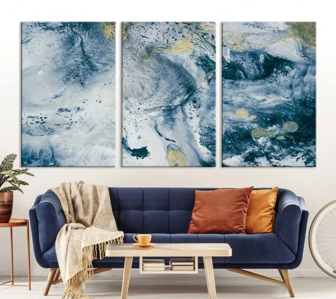 A modern living room features an Abstract Canvas Print as triptych artwork on the wall, elegantly showcased for enduring vibrancy.