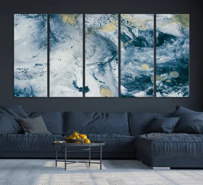 A modern living room features an Abstract Canvas Print as triptych artwork on the wall, elegantly showcased for enduring vibrancy.