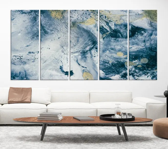 A modern living room features an Abstract Canvas Print as triptych artwork on the wall, elegantly showcased for enduring vibrancy.