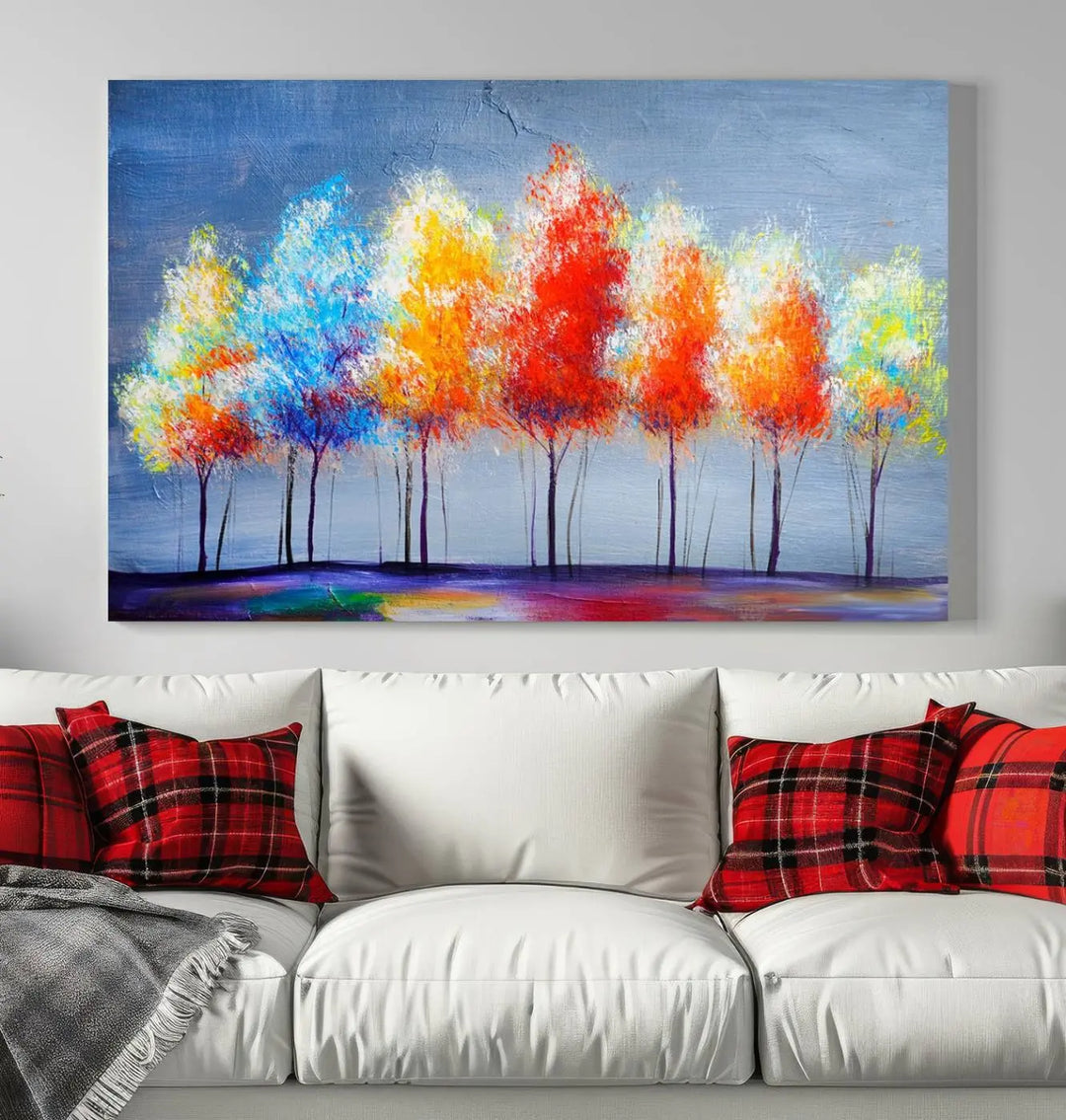 A triptych of the Abstract Colorful Trees Wall Art Canvas Print, gallery-wrapped on museum-quality canvas, adorns the wall.