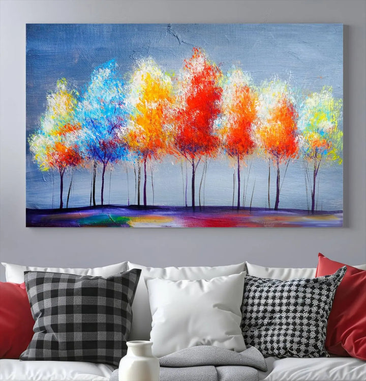 A triptych of the Abstract Colorful Trees Wall Art Canvas Print, gallery-wrapped on museum-quality canvas, adorns the wall.