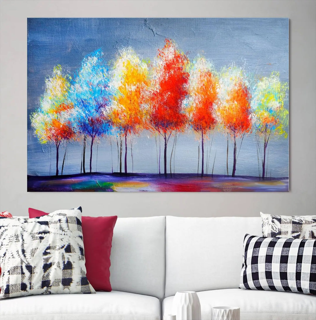 A triptych of the Abstract Colorful Trees Wall Art Canvas Print, gallery-wrapped on museum-quality canvas, adorns the wall.