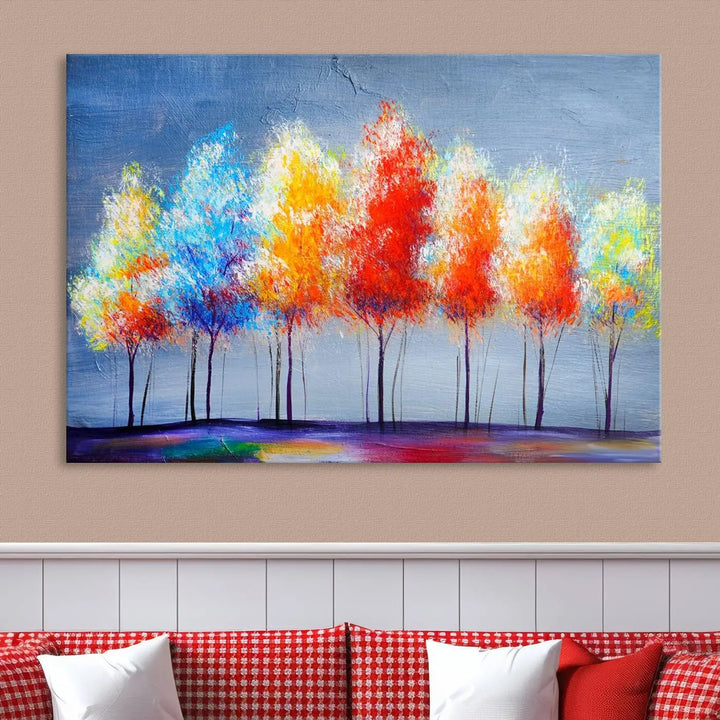 A triptych of the Abstract Colorful Trees Wall Art Canvas Print, gallery-wrapped on museum-quality canvas, adorns the wall.