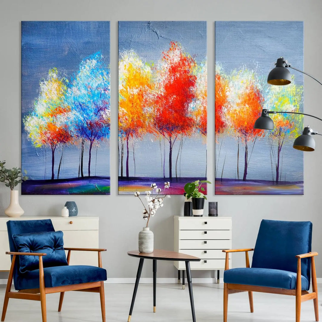 A triptych of the Abstract Colorful Trees Wall Art Canvas Print, gallery-wrapped on museum-quality canvas, adorns the wall.