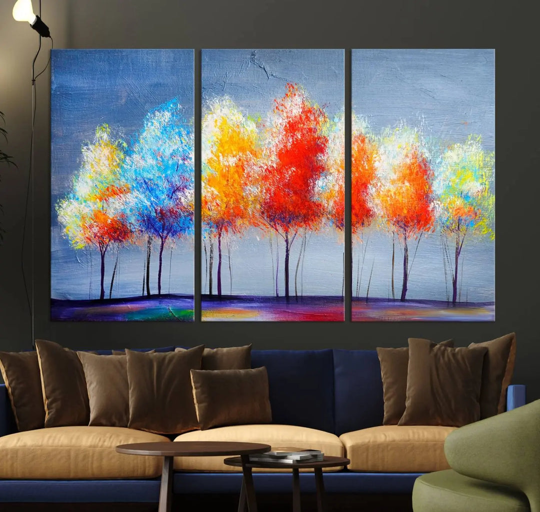 A triptych of the Abstract Colorful Trees Wall Art Canvas Print, gallery-wrapped on museum-quality canvas, adorns the wall.