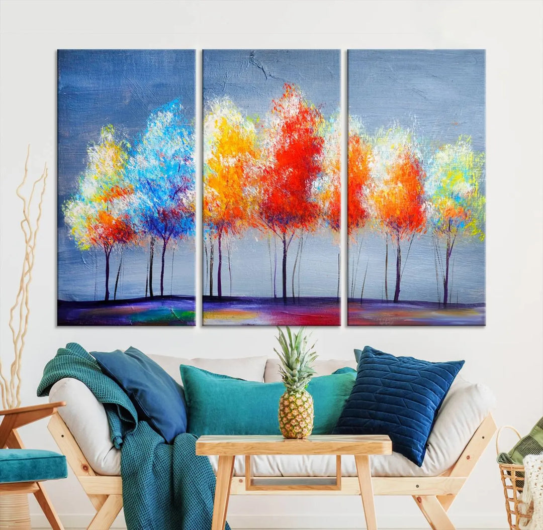 A triptych of the Abstract Colorful Trees Wall Art Canvas Print, gallery-wrapped on museum-quality canvas, adorns the wall.