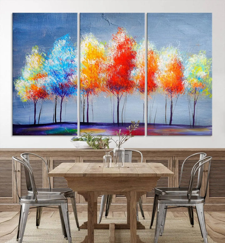 A triptych of the Abstract Colorful Trees Wall Art Canvas Print, gallery-wrapped on museum-quality canvas, adorns the wall.