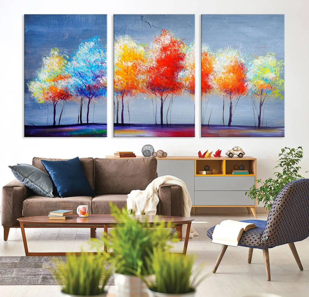 A triptych of the Abstract Colorful Trees Wall Art Canvas Print, gallery-wrapped on museum-quality canvas, adorns the wall.