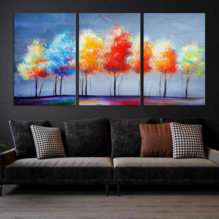 A triptych of the Abstract Colorful Trees Wall Art Canvas Print, gallery-wrapped on museum-quality canvas, adorns the wall.