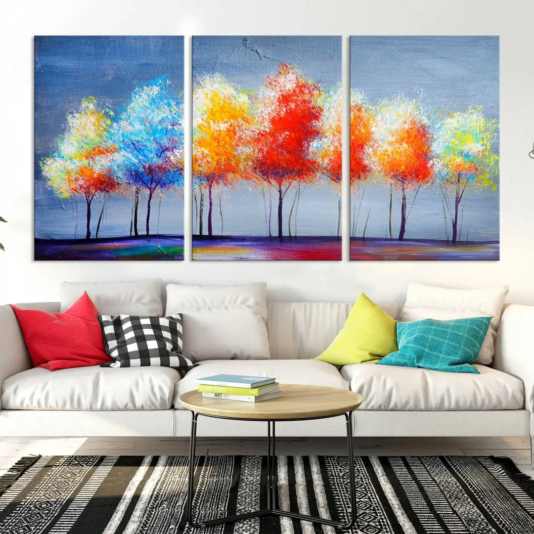 A triptych of the Abstract Colorful Trees Wall Art Canvas Print, gallery-wrapped on museum-quality canvas, adorns the wall.