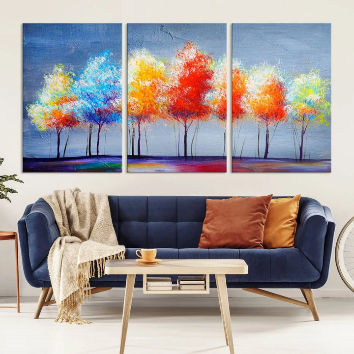 A triptych of the Abstract Colorful Trees Wall Art Canvas Print, gallery-wrapped on museum-quality canvas, adorns the wall.