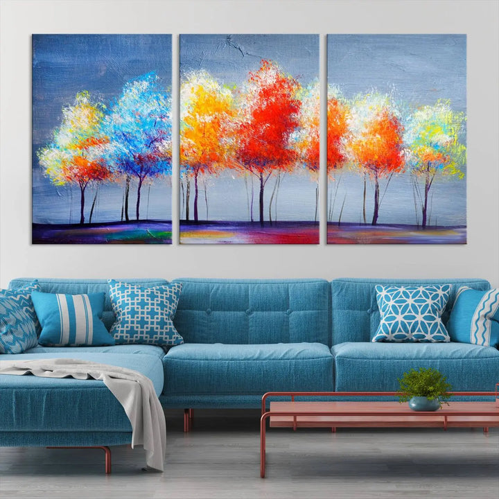 A triptych of the Abstract Colorful Trees Wall Art Canvas Print, gallery-wrapped on museum-quality canvas, adorns the wall.