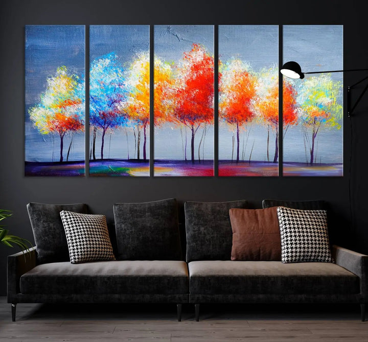 A triptych of the Abstract Colorful Trees Wall Art Canvas Print, gallery-wrapped on museum-quality canvas, adorns the wall.