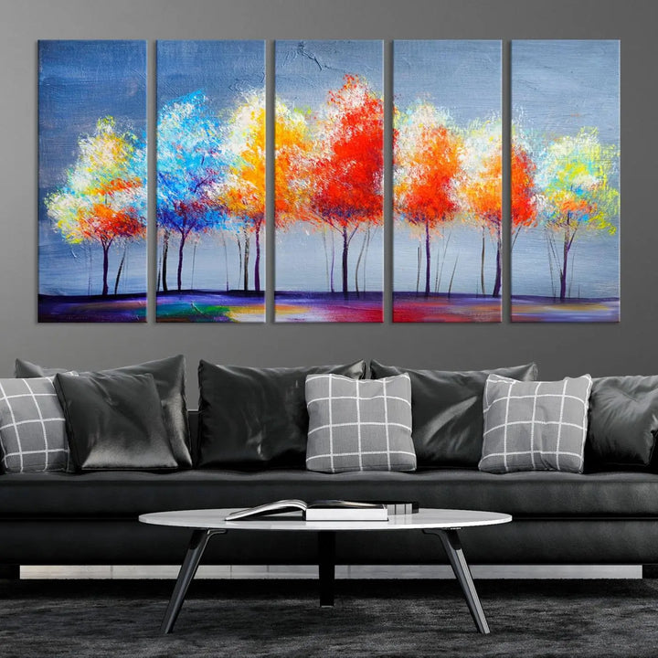 A triptych of the Abstract Colorful Trees Wall Art Canvas Print, gallery-wrapped on museum-quality canvas, adorns the wall.