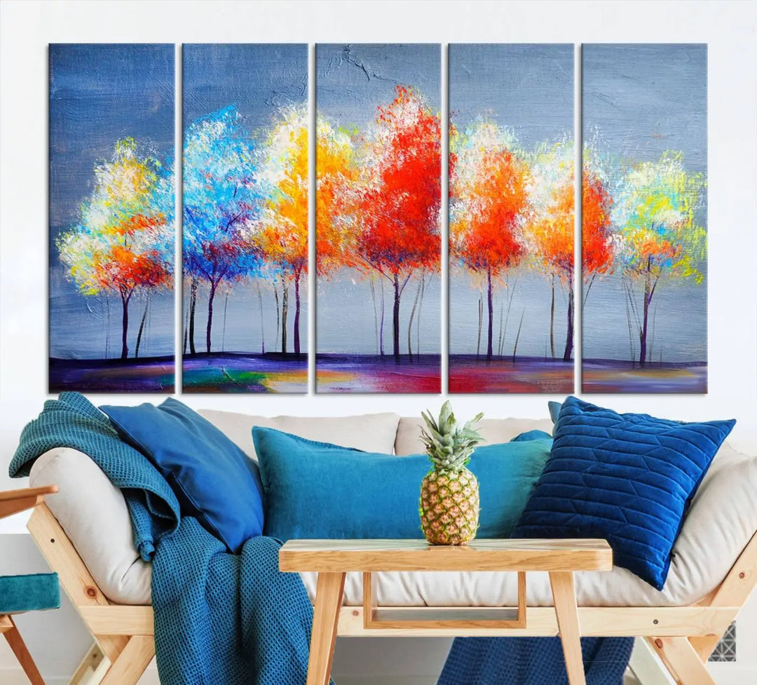 A triptych of the Abstract Colorful Trees Wall Art Canvas Print, gallery-wrapped on museum-quality canvas, adorns the wall.