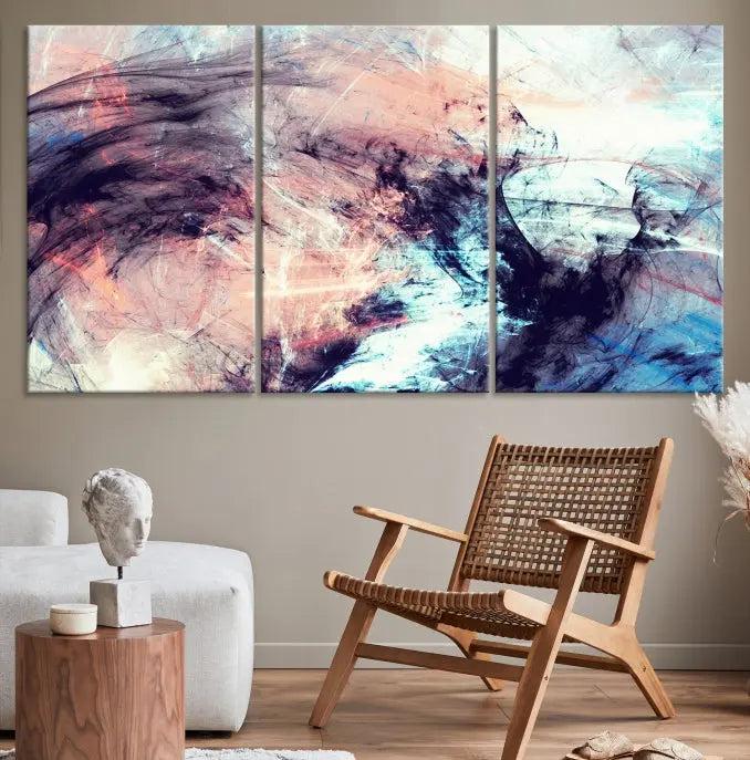 The Abstract Colors Wall Art Canvas Print features a triptych design with swirling purple, pink, and blue hues. This museum-quality piece on polycotton canvas is expertly hand-assembled and comes ready to hang.