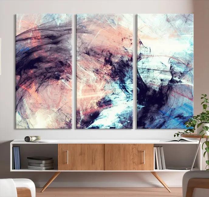 The Abstract Colors Wall Art Canvas Print features a triptych design with swirling purple, pink, and blue hues. This museum-quality piece on polycotton canvas is expertly hand-assembled and comes ready to hang.