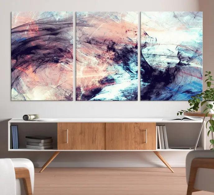 The Abstract Colors Wall Art Canvas Print features a triptych design with swirling purple, pink, and blue hues. This museum-quality piece on polycotton canvas is expertly hand-assembled and comes ready to hang.