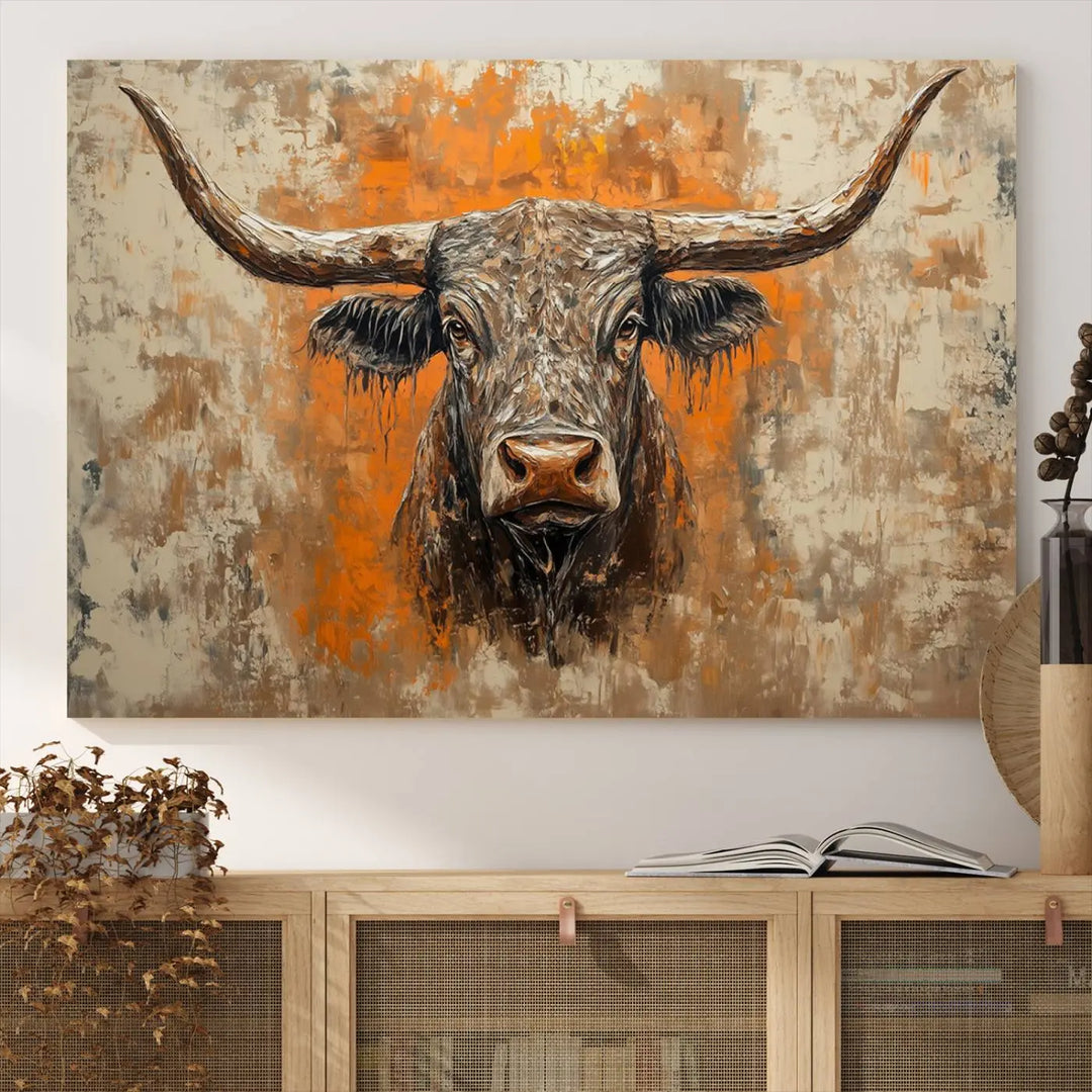 The Abstract Cow Longhorn Bull Wall Art Canvas Print, also known as Rustic Texas Western Cattle Artwork, captures the essence of rustic wall decor with its depiction of a longhorn bull with distinctive, curved horns against a textured, orange and beige abstract background. It's an ideal choice for introducing nature-inspired elements to any environment.