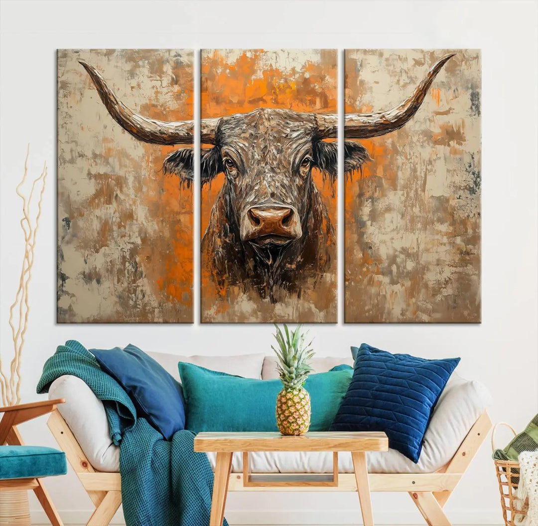 The Abstract Cow Longhorn Bull Wall Art Canvas Print, also known as Rustic Texas Western Cattle Artwork, captures the essence of rustic wall decor with its depiction of a longhorn bull with distinctive, curved horns against a textured, orange and beige abstract background. It's an ideal choice for introducing nature-inspired elements to any environment.