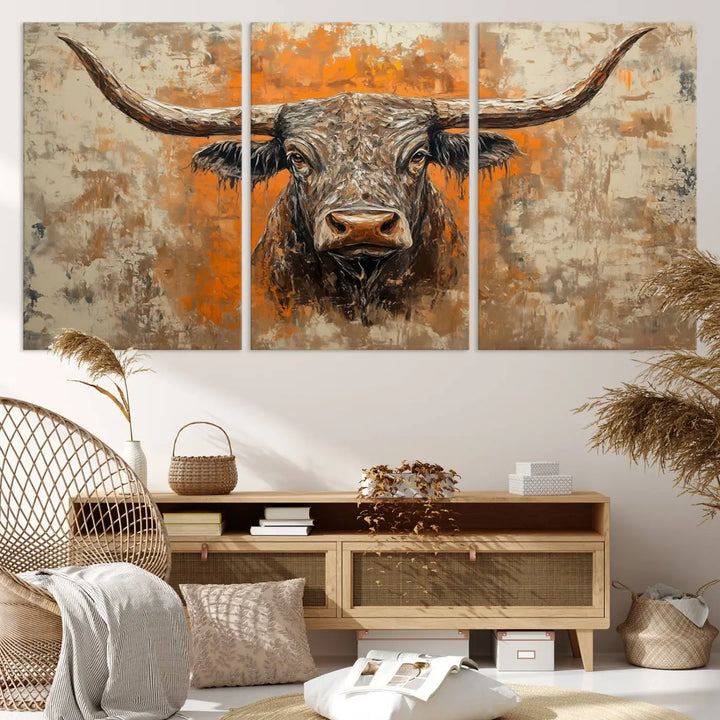 The Abstract Cow Longhorn Bull Wall Art Canvas Print, also known as Rustic Texas Western Cattle Artwork, captures the essence of rustic wall decor with its depiction of a longhorn bull with distinctive, curved horns against a textured, orange and beige abstract background. It's an ideal choice for introducing nature-inspired elements to any environment.