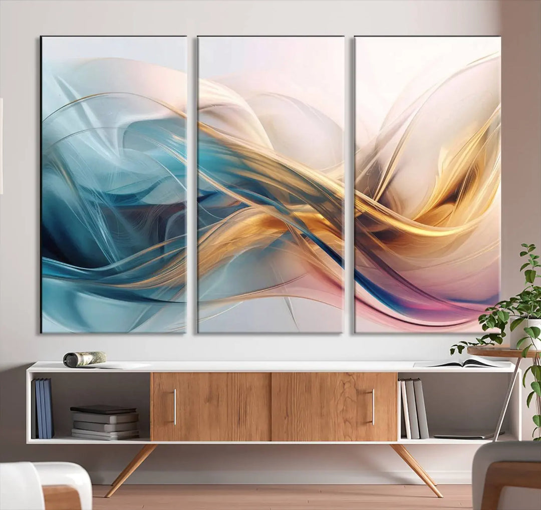 The Abstract Flowing Colors Wall Art, featuring swirling lines in blue, gold, and pink, brings a touch of modern elegance to the space. It's ideal for those who appreciate contemporary decor and want to make a bold statement.