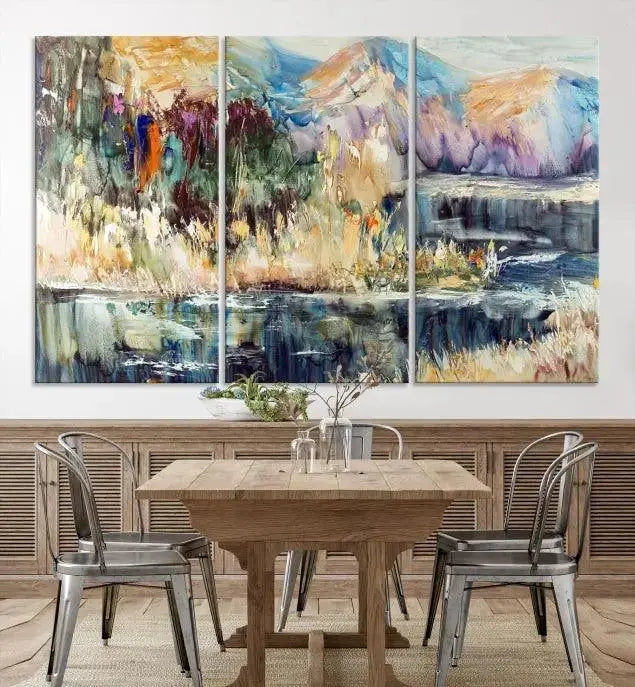 A vibrant Abstract Landscape Waterfall Canvas Art adorns the wall in this cozy living room. This 3-panel large wall art enhances the inviting space's vivid collection. This premium quality, ready-to-hang print is perfect for a living room, office, or lounge.