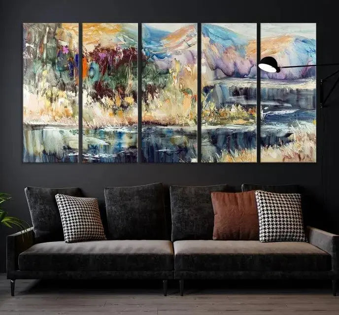 A vibrant Abstract Landscape Waterfall Canvas Art adorns the wall in this cozy living room. This 3-panel large wall art enhances the inviting space's vivid collection. This premium quality, ready-to-hang print is perfect for a living room, office, or lounge.