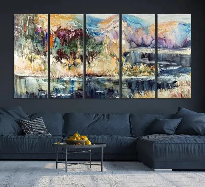 A vibrant Abstract Landscape Waterfall Canvas Art adorns the wall in this cozy living room. This 3-panel large wall art enhances the inviting space's vivid collection. This premium quality, ready-to-hang print is perfect for a living room, office, or lounge.