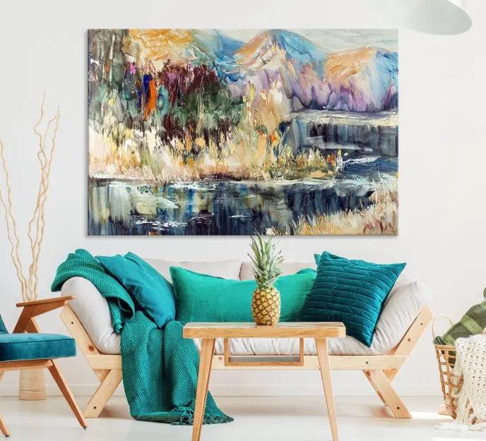 A vibrant Abstract Landscape Waterfall Canvas Art adorns the wall in this cozy living room. This 3-panel large wall art enhances the inviting space's vivid collection. This premium quality, ready-to-hang print is perfect for a living room, office, or lounge.