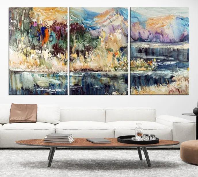 A vibrant Abstract Landscape Waterfall Canvas Art adorns the wall in this cozy living room. This 3-panel large wall art enhances the inviting space's vivid collection. This premium quality, ready-to-hang print is perfect for a living room, office, or lounge.