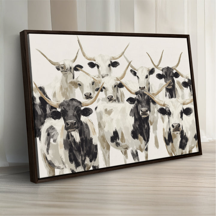 Canvas print titled Longhorn Texas Cow Drawing, depicting longhorn cattle with black and white markings, made in the USA, displayed on the wall.