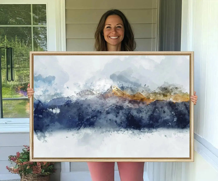 A stunning Abstract Mountain Range Art Canvas Print in a 3-panel watercolor landscape design is displayed on the wall.