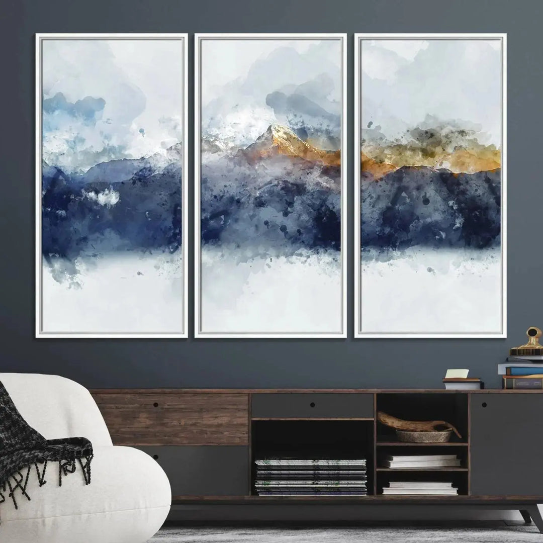 A stunning Abstract Mountain Range Art Canvas Print in a 3-panel watercolor landscape design is displayed on the wall.