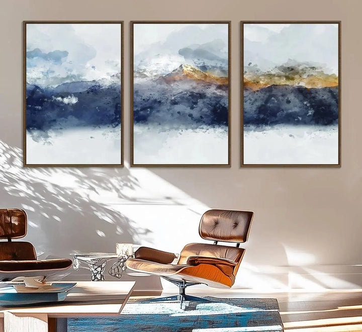 A stunning Abstract Mountain Range Art Canvas Print in a 3-panel watercolor landscape design is displayed on the wall.