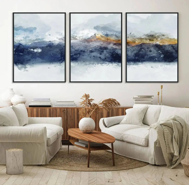A stunning Abstract Mountain Range Art Canvas Print in a 3-panel watercolor landscape design is displayed on the wall.