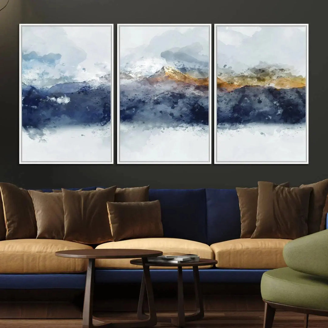 A stunning Abstract Mountain Range Art Canvas Print in a 3-panel watercolor landscape design is displayed on the wall.