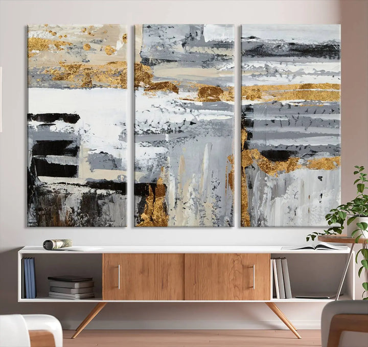 An intriguing abstract painting titled "Abstract Painting Canvas Wall Art Print Paint Drip Art Brush Strokes Gray Artwork" is displayed on a museum-quality canvas with a UV-protective coating. Featuring gold and gray brushstrokes, it hovers elegantly on the wall, perfectly suited to a modern, dimly lit room. Additionally, the artwork is conveniently ready to hang straight from the box.