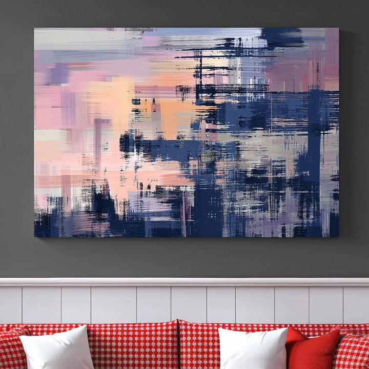 The Abstract Painting Wall Art Canvas Print Split Canvas Art, featuring pink, peach, and navy blue tones, decorates the wall. This museum-quality canvas is equipped with a UV-protective coating to preserve its vivid colors and comes ready to hang for your convenience.