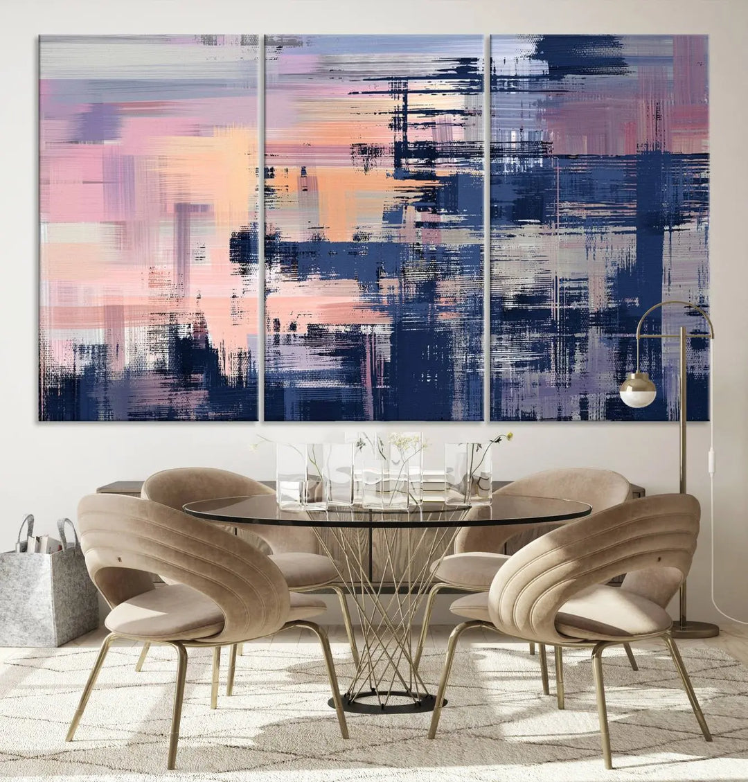 The Abstract Painting Wall Art Canvas Print Split Canvas Art, featuring pink, peach, and navy blue tones, decorates the wall. This museum-quality canvas is equipped with a UV-protective coating to preserve its vivid colors and comes ready to hang for your convenience.