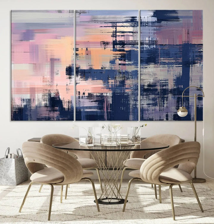 The Abstract Painting Wall Art Canvas Print Split Canvas Art, featuring pink, peach, and navy blue tones, decorates the wall. This museum-quality canvas is equipped with a UV-protective coating to preserve its vivid colors and comes ready to hang for your convenience.