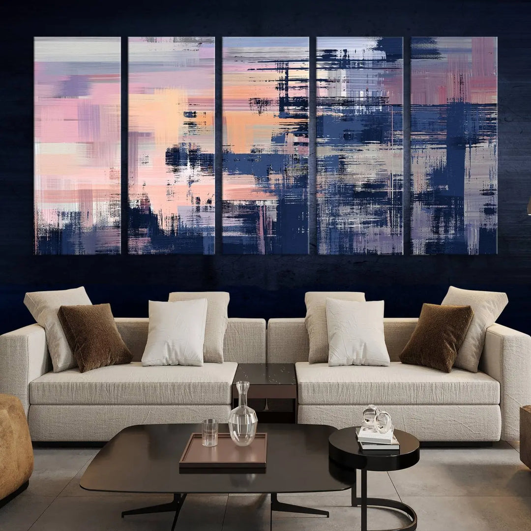 The Abstract Painting Wall Art Canvas Print Split Canvas Art, featuring pink, peach, and navy blue tones, decorates the wall. This museum-quality canvas is equipped with a UV-protective coating to preserve its vivid colors and comes ready to hang for your convenience.