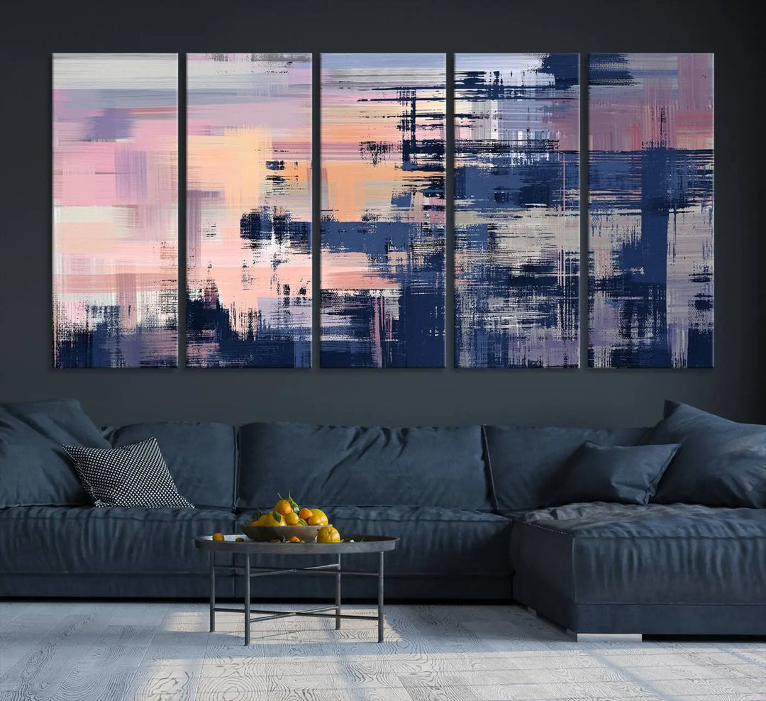 The Abstract Painting Wall Art Canvas Print Split Canvas Art, featuring pink, peach, and navy blue tones, decorates the wall. This museum-quality canvas is equipped with a UV-protective coating to preserve its vivid colors and comes ready to hang for your convenience.