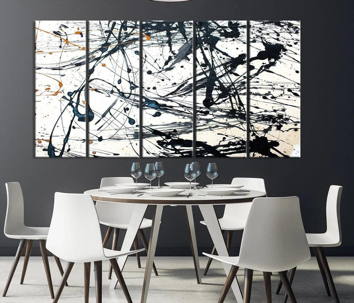 The Abstract Splash Wall Art Canvas Print, featuring a triptych design with blue and black splatters on a white background, is crafted on museum-quality canvas. It includes a UV-protective coating to maintain its vibrant appearance over time.