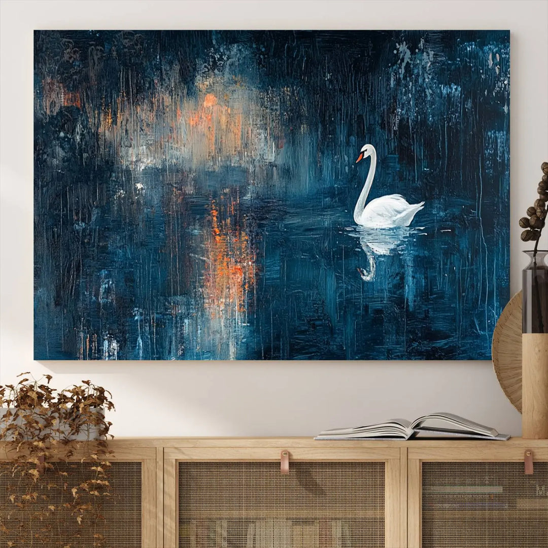 The Abstract Swan Wall Art is a captivating canvas print featuring a moody blue and orange swan on dark water, perfect for enhancing contemporary home decor.